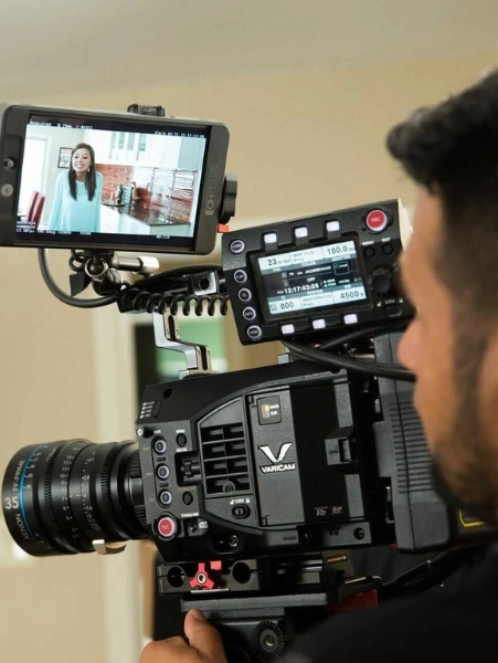 Best Online Video Script Writing Services in Hyderabad A man uses steady thorough attention to his subject when applying scriptwriting & video production.