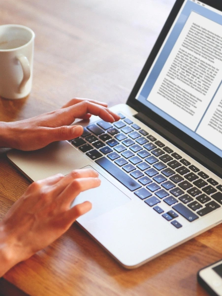 Best Content Writer and Editorial Service in Hyderabad A person is working on his laptop to write content and edit it to maintain a structural manuscript.