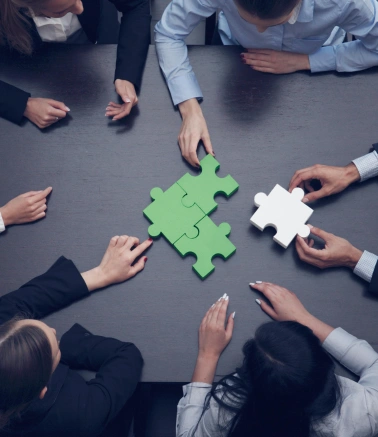 Top Digital Media Consultants at Best Price in Hyderabad Collaboration services are demonstrated by a group of people sitting together and solving puzzles.