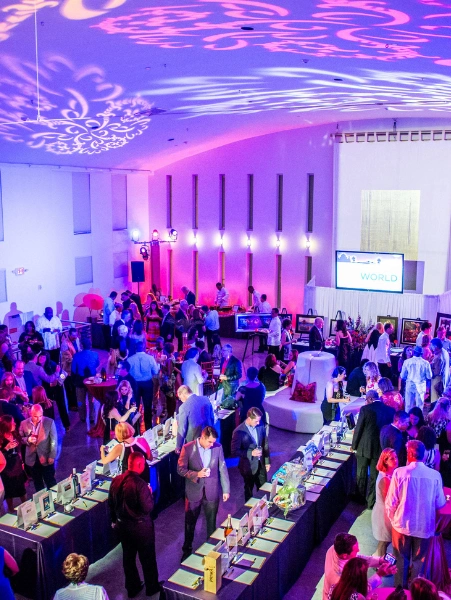 A sizable crowd enjoying a happy celebration, demonstrating a vibrant & exciting product launch event